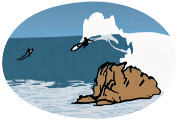 Surfer dropping in at the rock